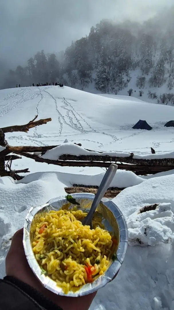 Maggi in the snow at camp
