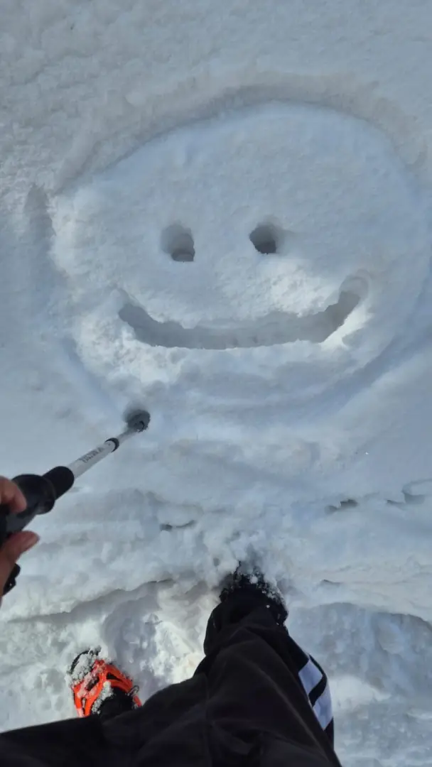 Smiley face drawn in the snow